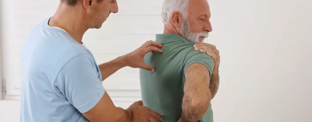 an old man having Back Pain